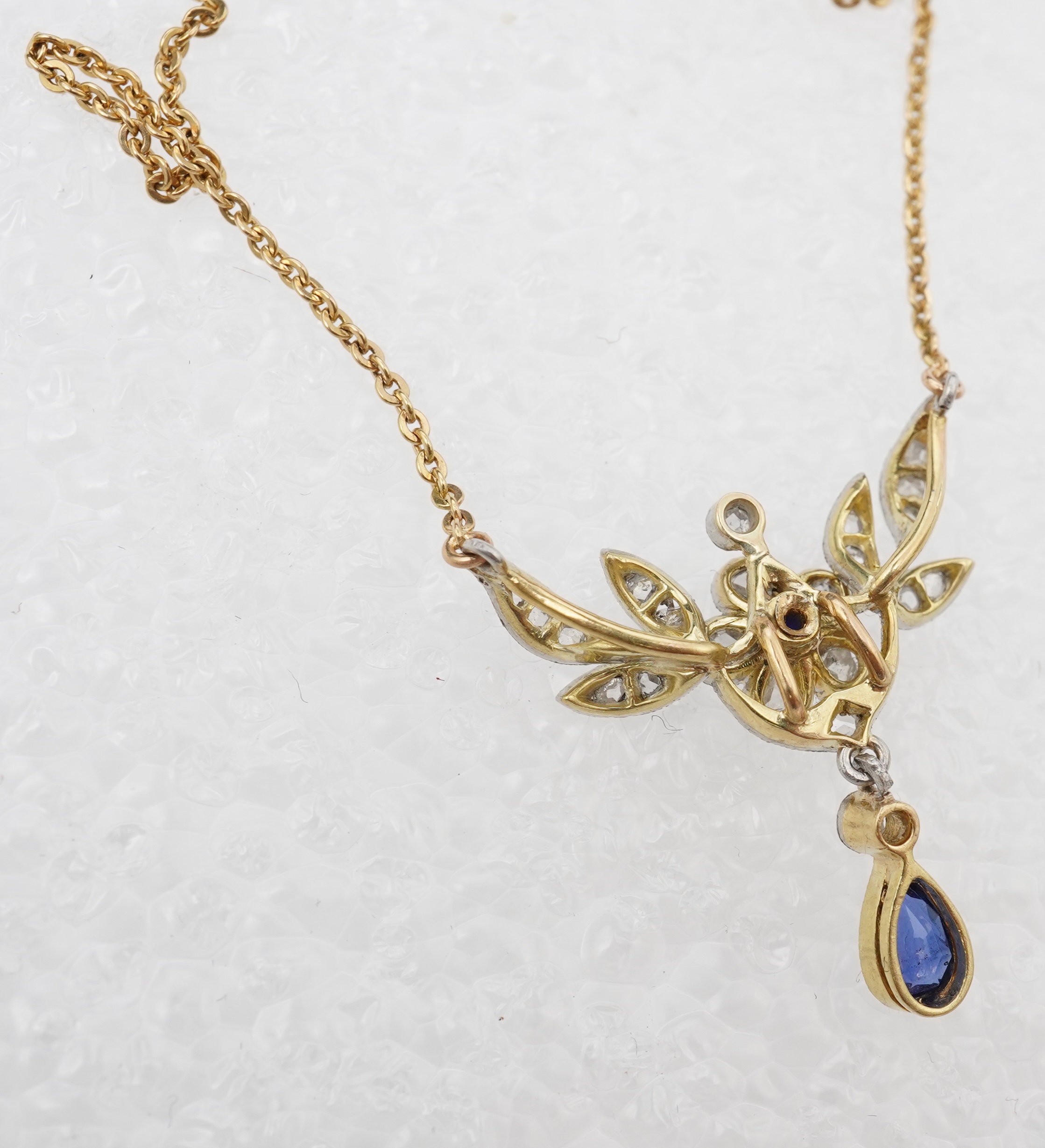 A sapphire and diamond pendant